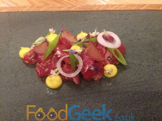 Raw ox in coal oil, assorted onions, hyssop, mustard mayo