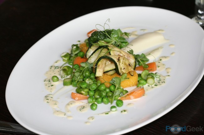 Grilled polenta, artichoke puree, courgettes, peas, broad beans, asparagus, herb veloute